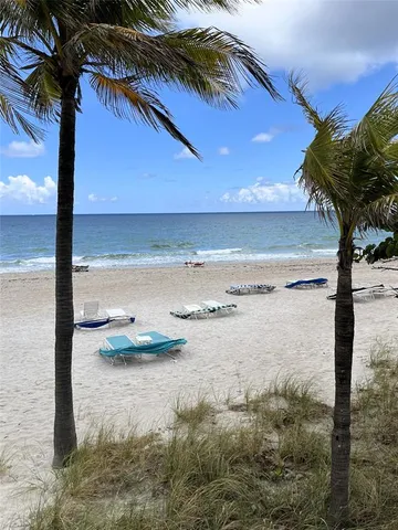 a lobby with furniture and mirror