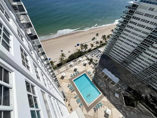 a view of a balcony with an ocean view