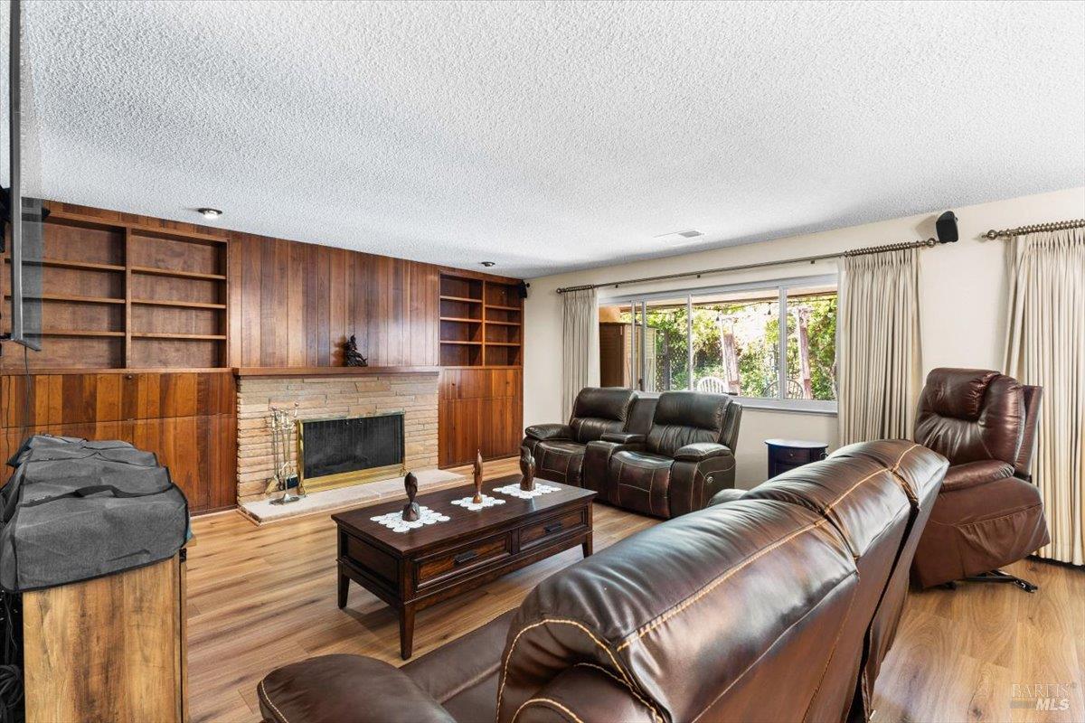 442 Las Casitas Court, Unit A Santa Rosa, CA 95403 - Photo 14 of 33 a living room with furniture and a fireplace