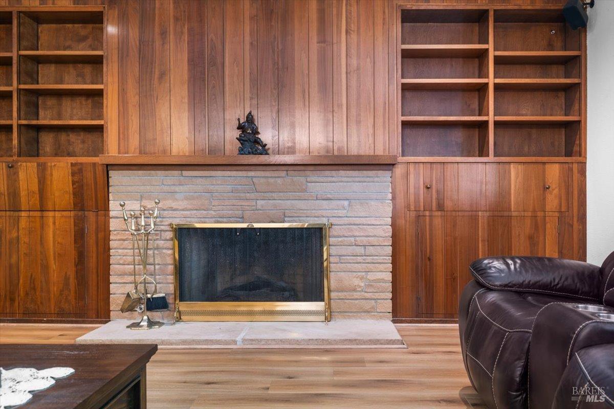 442 Las Casitas Court, Unit A Santa Rosa, CA 95403 - Photo 15 of 33 a living room with a fireplace and a wooden floor