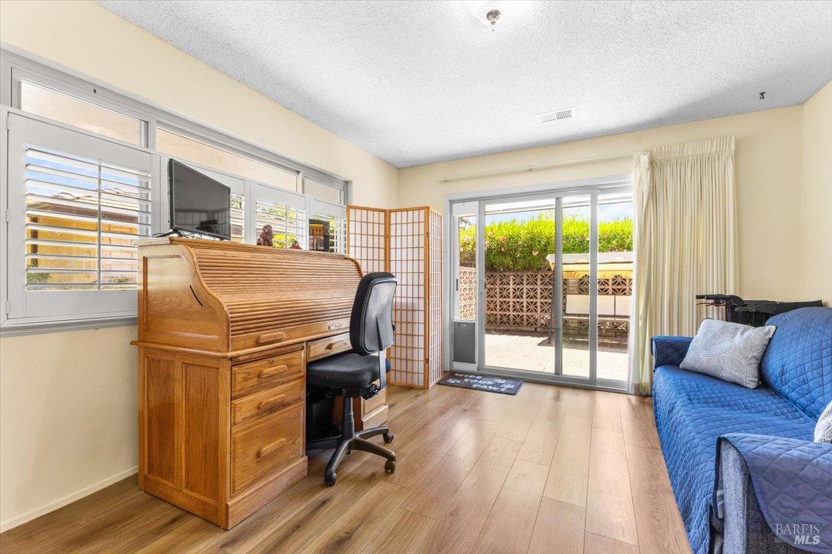 442 Las Casitas Court, Unit A Santa Rosa, CA 95403 - Photo 19 of 33 a bedroom with furniture and a window