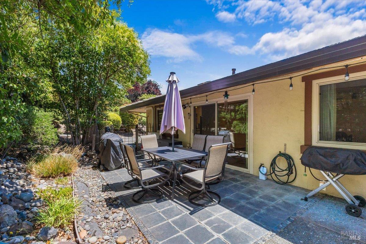 442 Las Casitas Court, Unit A Santa Rosa, CA 95403 - Photo 24 of 33 a view of a patio with table and chairs and potted plants