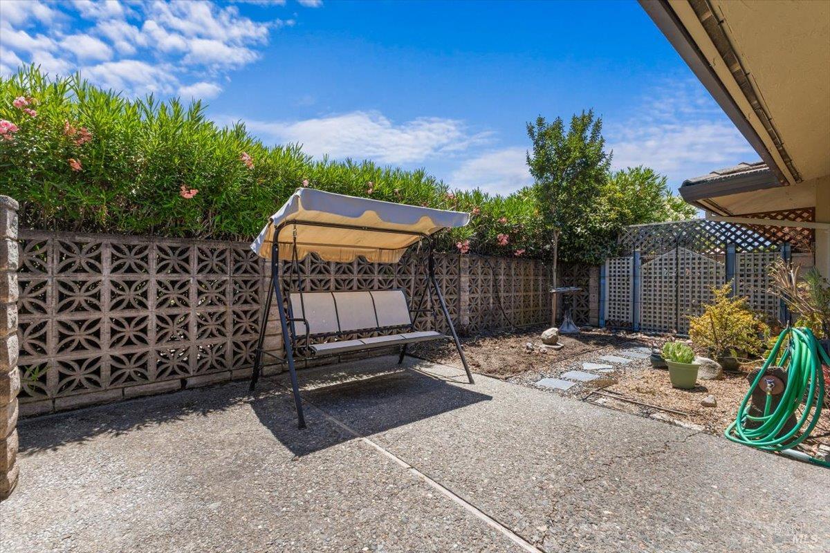 442 Las Casitas Court, Unit A Santa Rosa, CA 95403 - Photo 25 of 33 a view of a backyard with a bench and potted plants