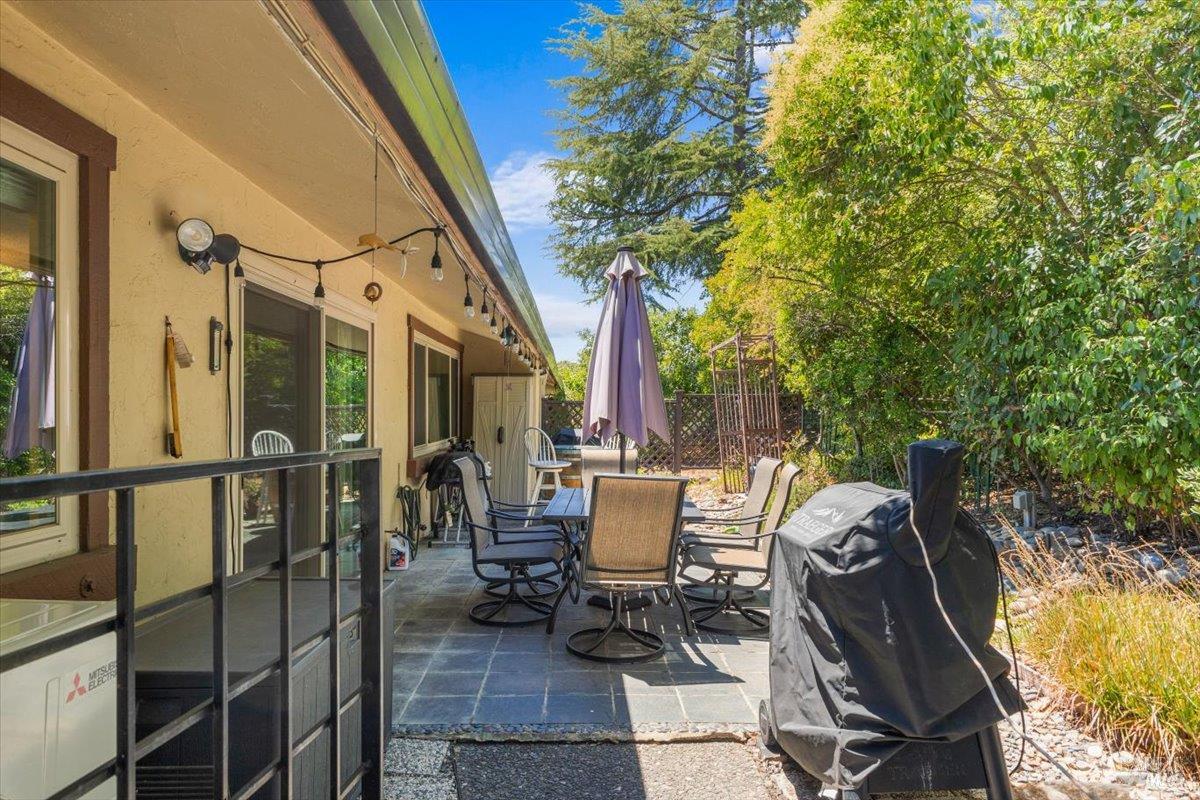 442 Las Casitas Court, Unit A Santa Rosa, CA 95403 - Photo 27 of 33 a view of a balcony with chairs and a potted plant