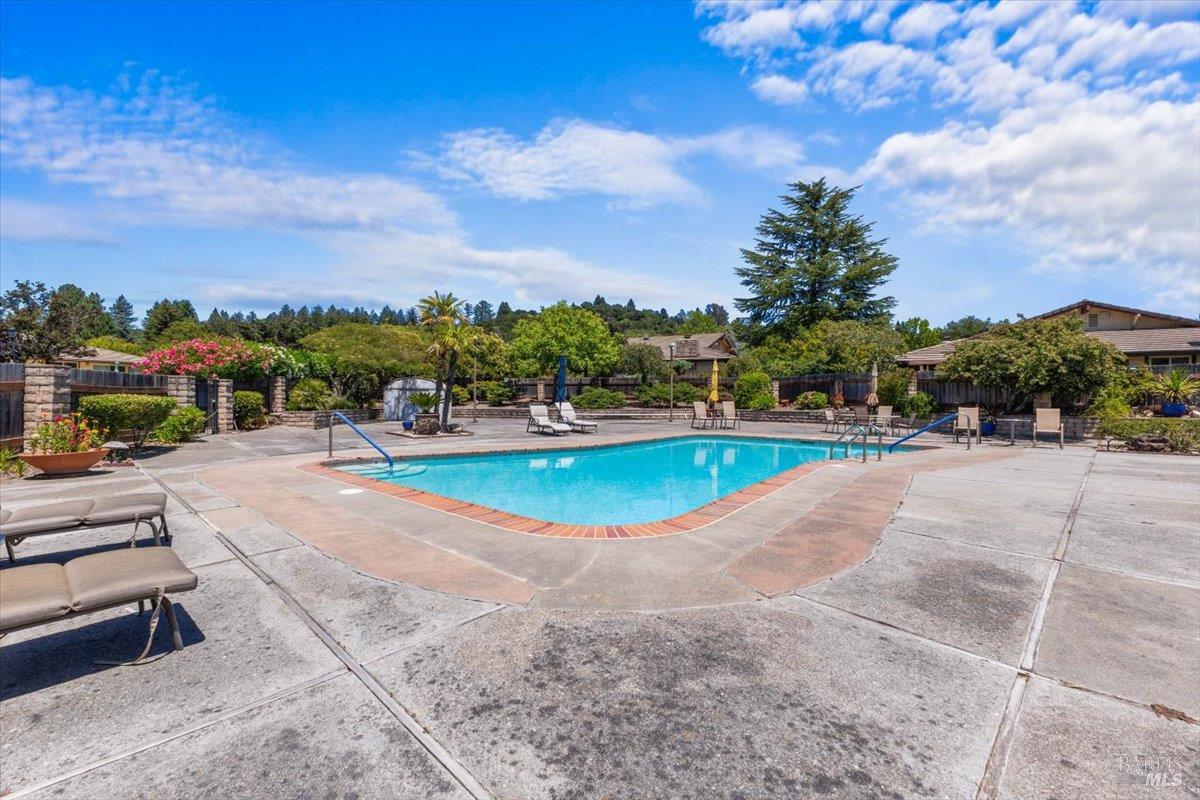 442 Las Casitas Court, Unit A Santa Rosa, CA 95403 - Photo 28 of 33 a view of a swimming pool with a patio and a yard
