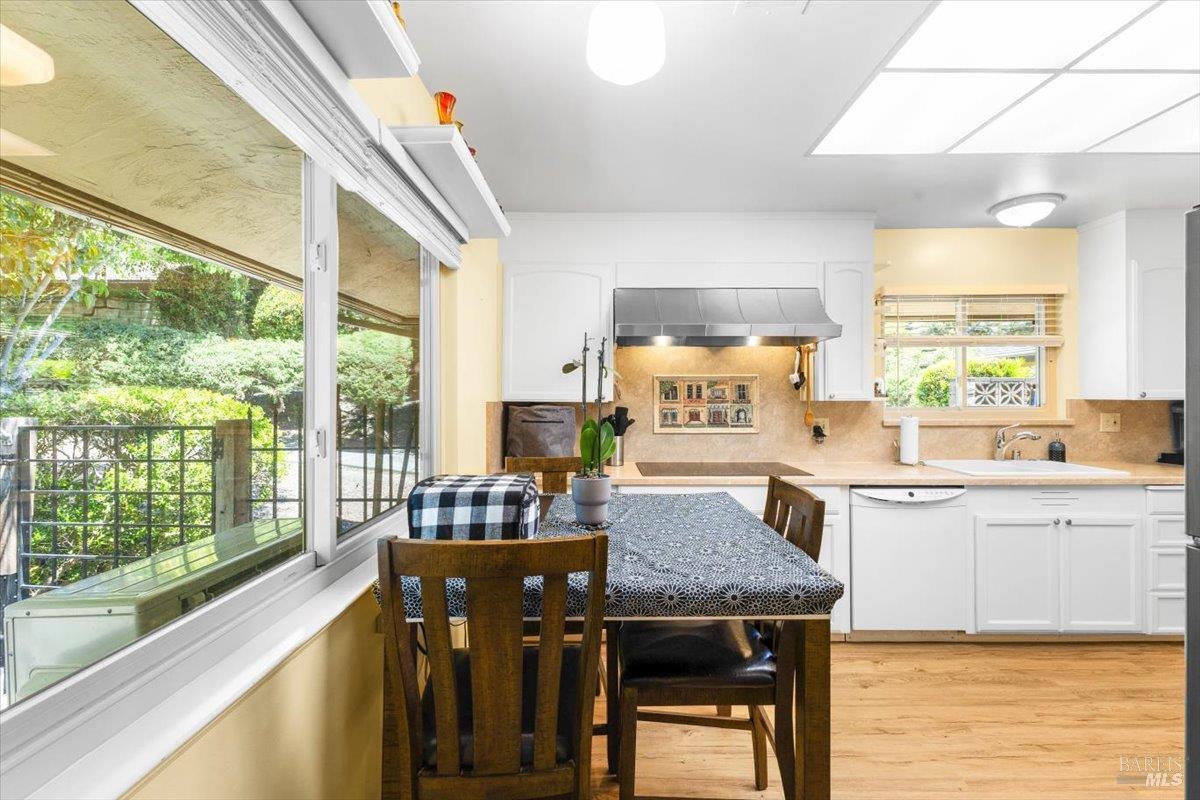 442 Las Casitas Court, Unit A Santa Rosa, CA 95403 - Photo 8 of 33 a kitchen with a table chairs sink and cabinets