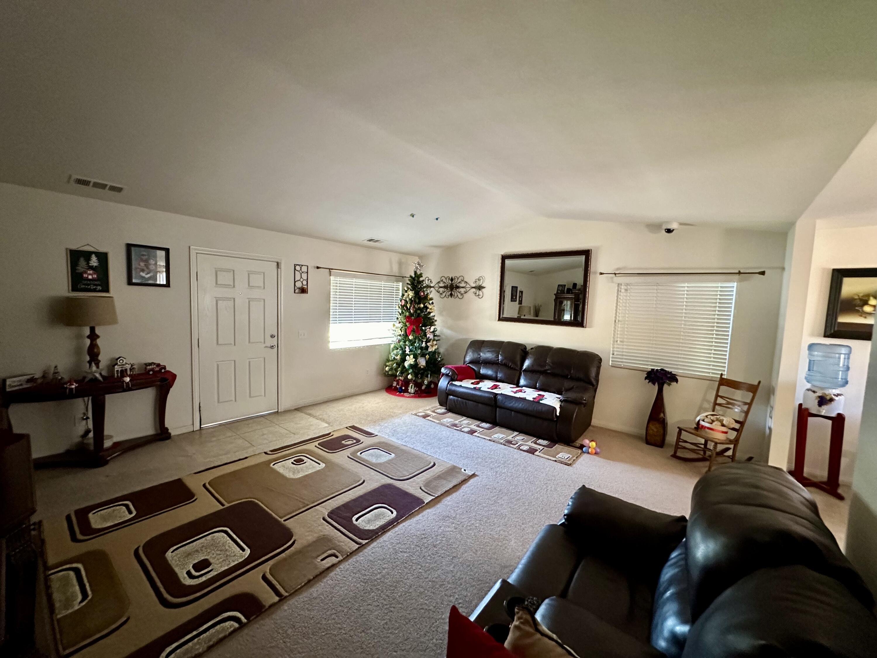 575 West Rice Street Blythe, CA 92225 - Photo 11 of 24 a living room with furniture and a flat screen tv