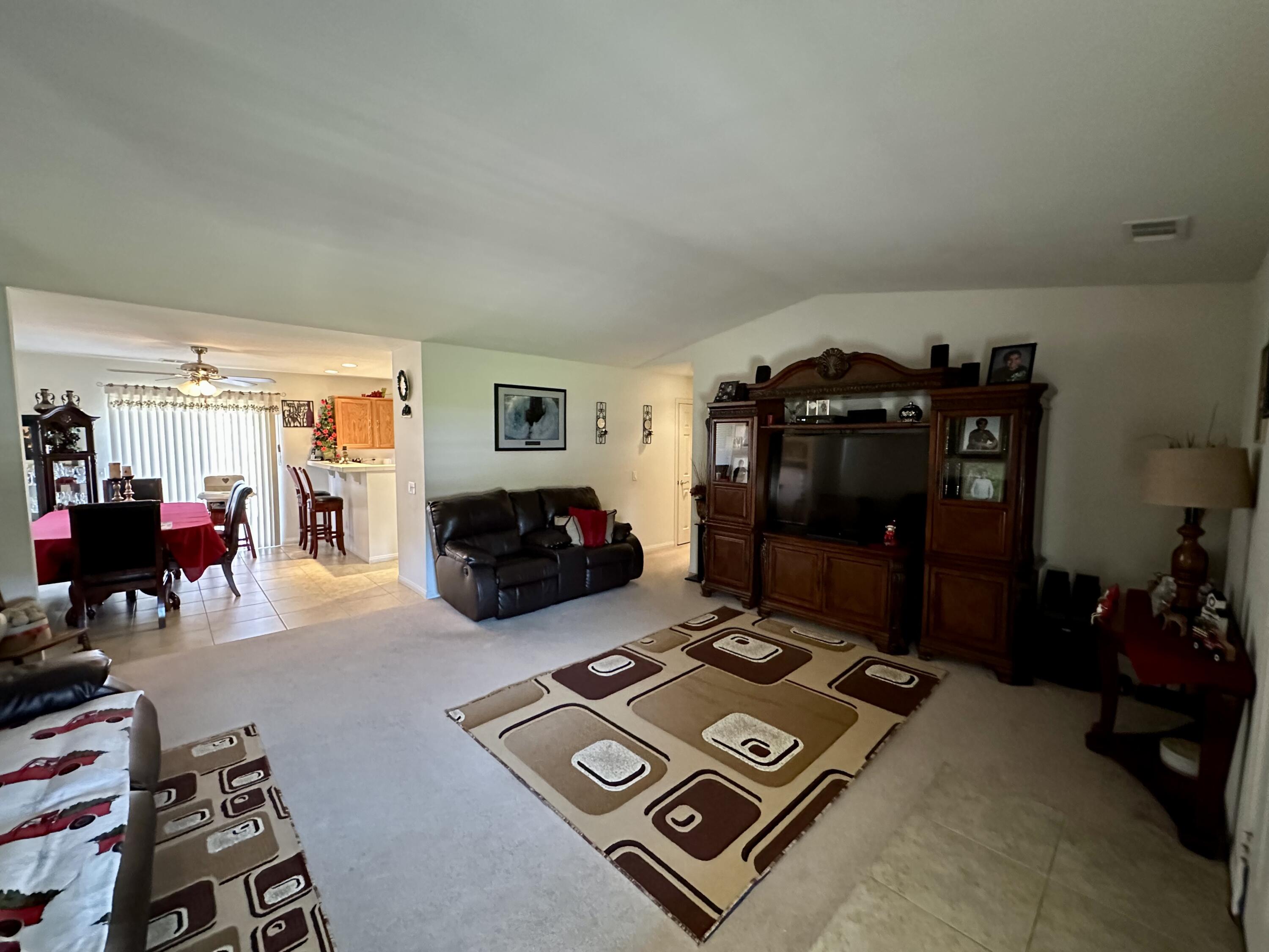 575 West Rice Street Blythe, CA 92225 - Photo 12 of 24 a living room with furniture a gym equipment and a large window