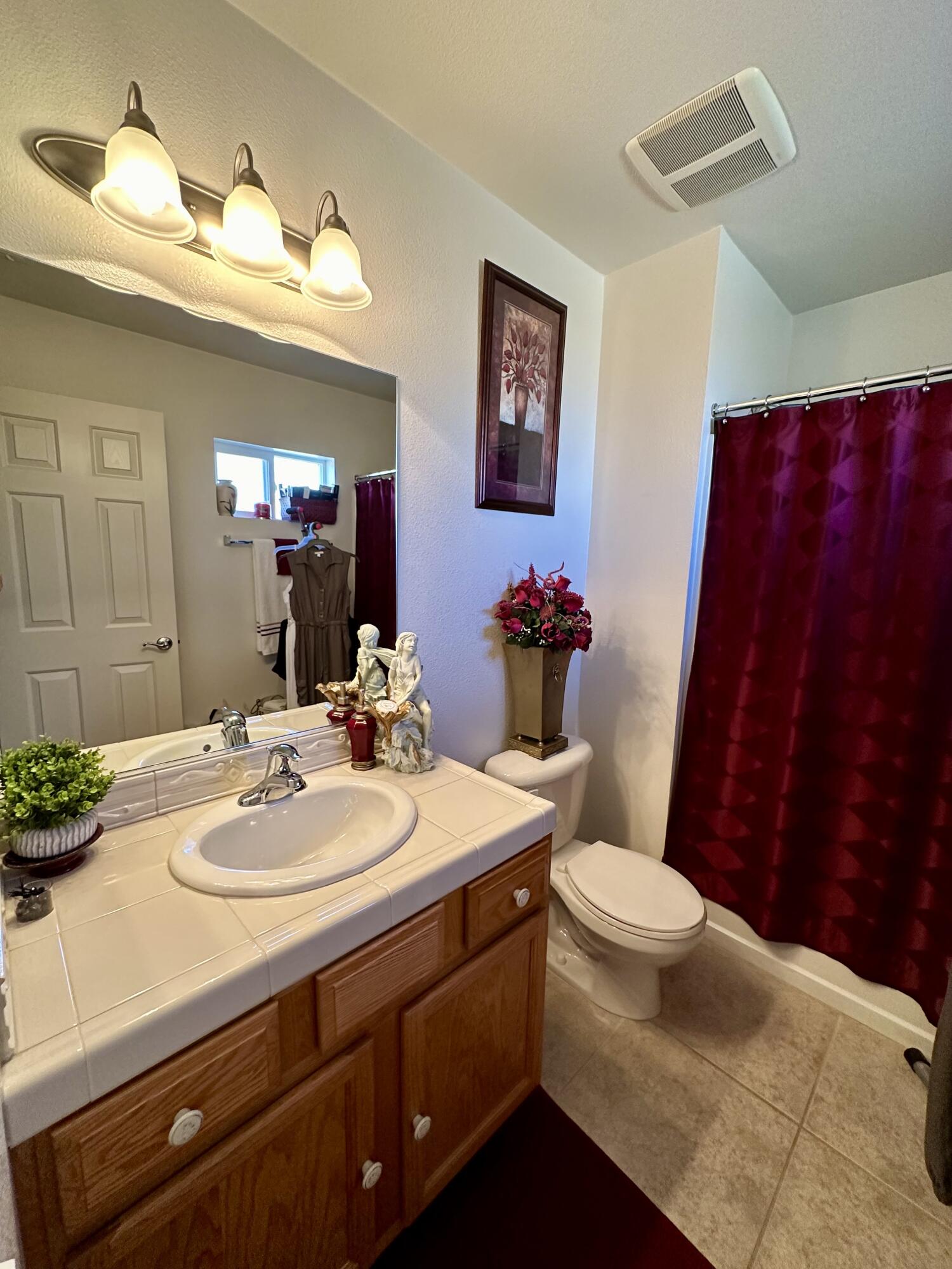 575 West Rice Street Blythe, CA 92225 - Photo 16 of 24 a bathroom with a sink a toilet and mirror