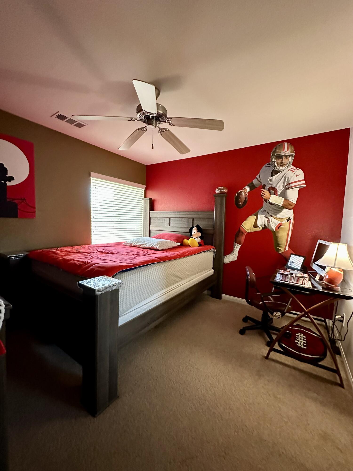 575 West Rice Street Blythe, CA 92225 - Photo 20 of 24 a bedroom with a bed and gym equipment