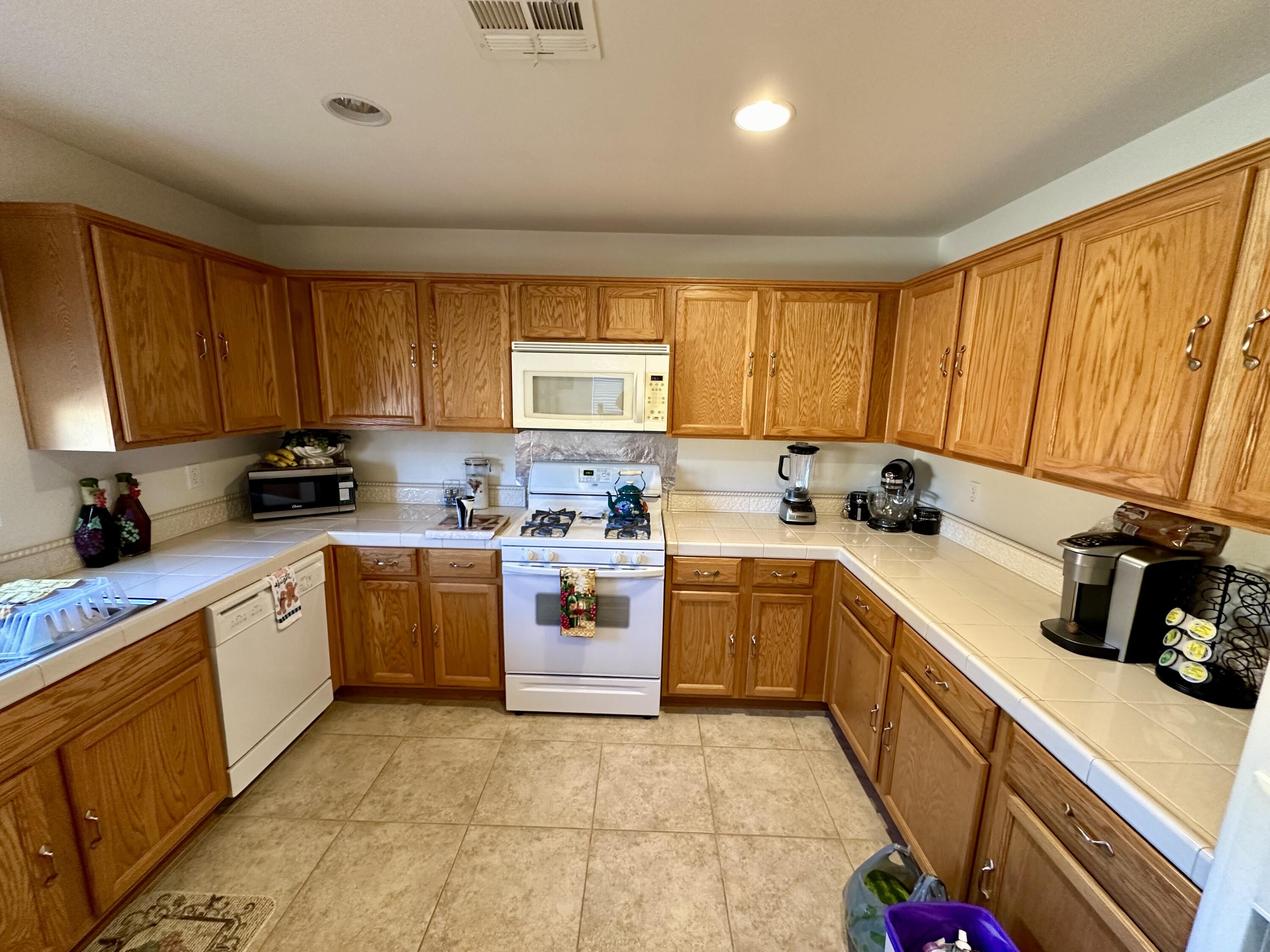 575 West Rice Street Blythe, CA 92225 - Photo 6 of 24 a kitchen with a sink cabinets and window