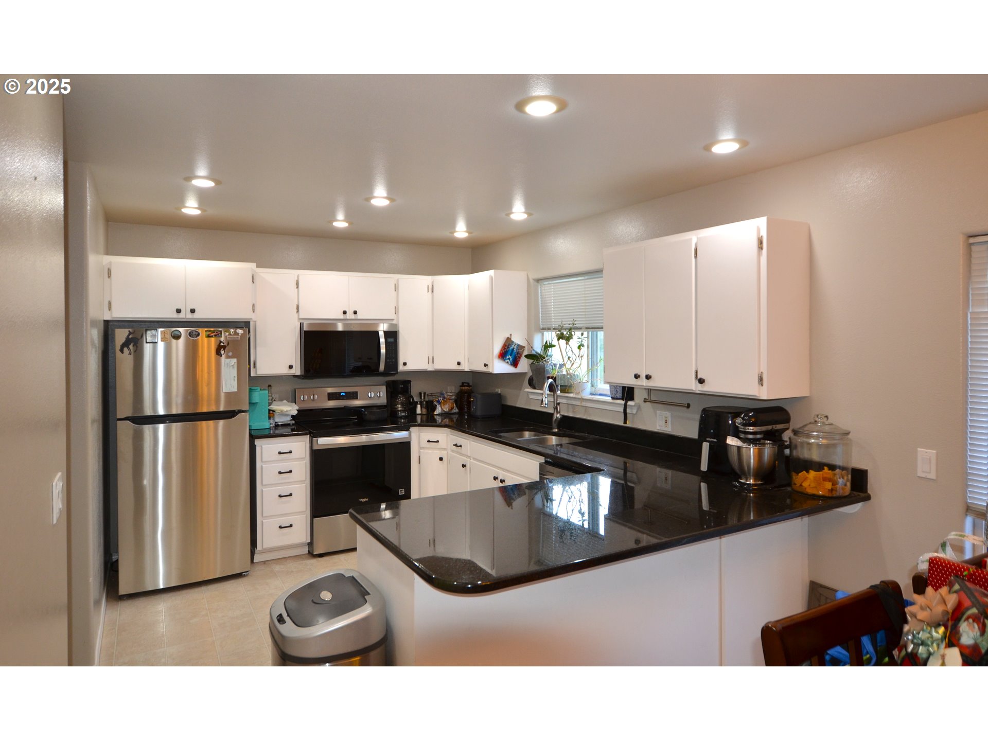 1616 Southwest 2nd Street Pendleton, OR 97801 - Photo 6 of 23 a kitchen with sink refrigerator and microwave