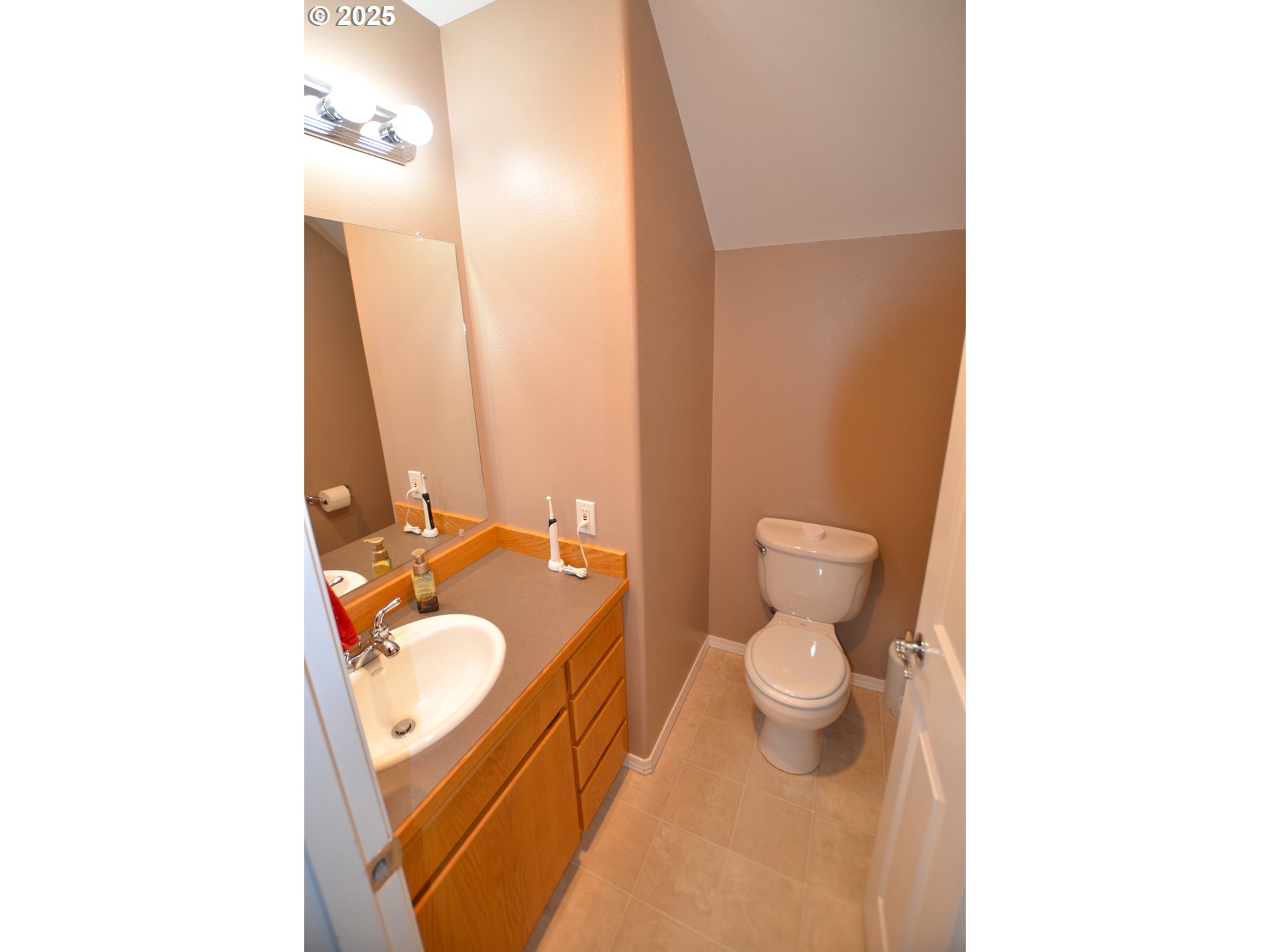 1616 Southwest 2nd Street Pendleton, OR 97801 - Photo 9 of 23 a bathroom with a granite countertop toilet and a sink