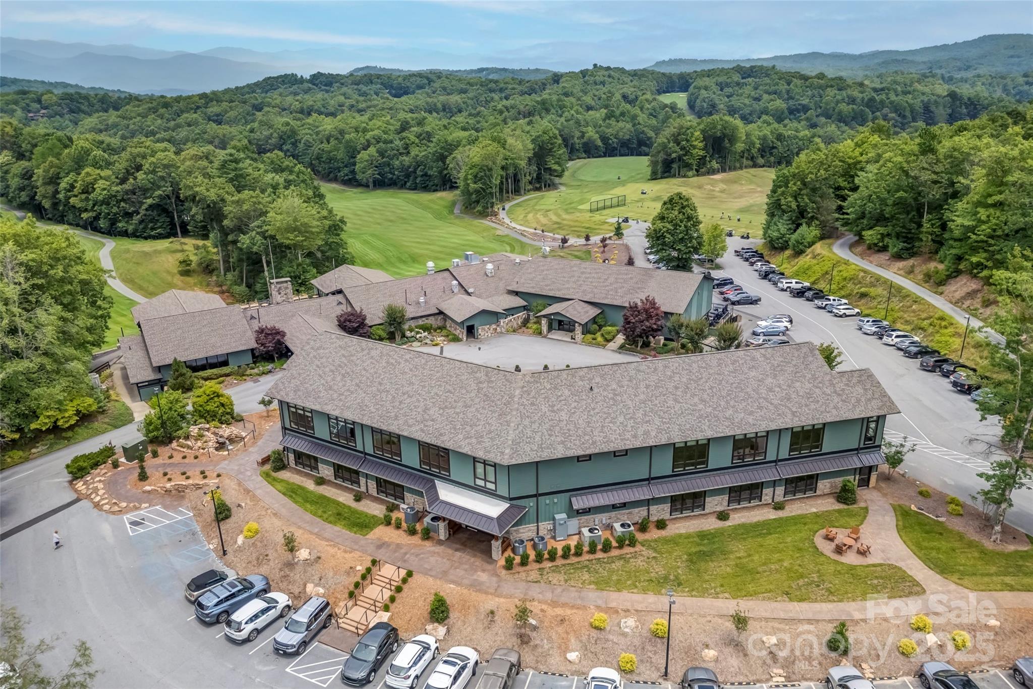 Lot 129 Inoli Circle, Unit 129/7 Brevard, NC 28712 - Photo 22 of 25 an aerial view of a house with a swimming pool