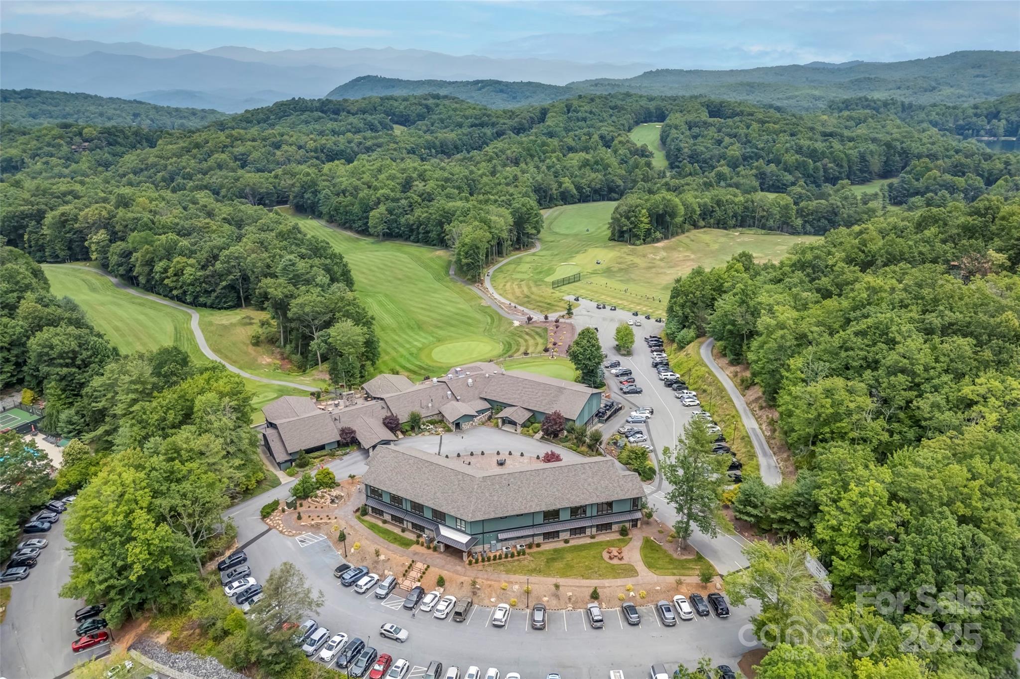 Lot 129 Inoli Circle, Unit 129/7 Brevard, NC 28712 - Photo 23 of 25 an aerial view of a house with a yard