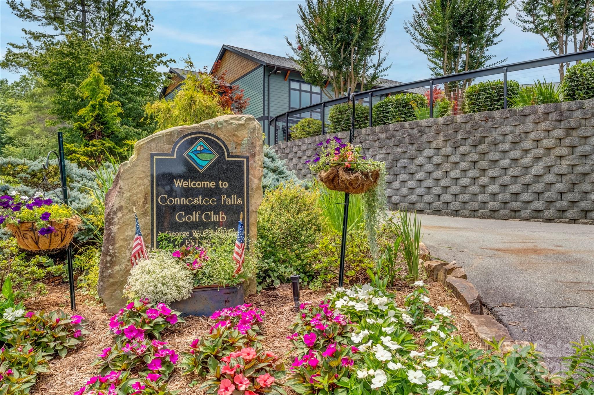 Lot 129 Inoli Circle, Unit 129/7 Brevard, NC 28712 - Photo 25 of 25 a bunch of flowers are in a yard