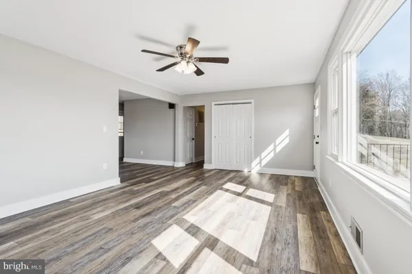 a view of an empty room and window