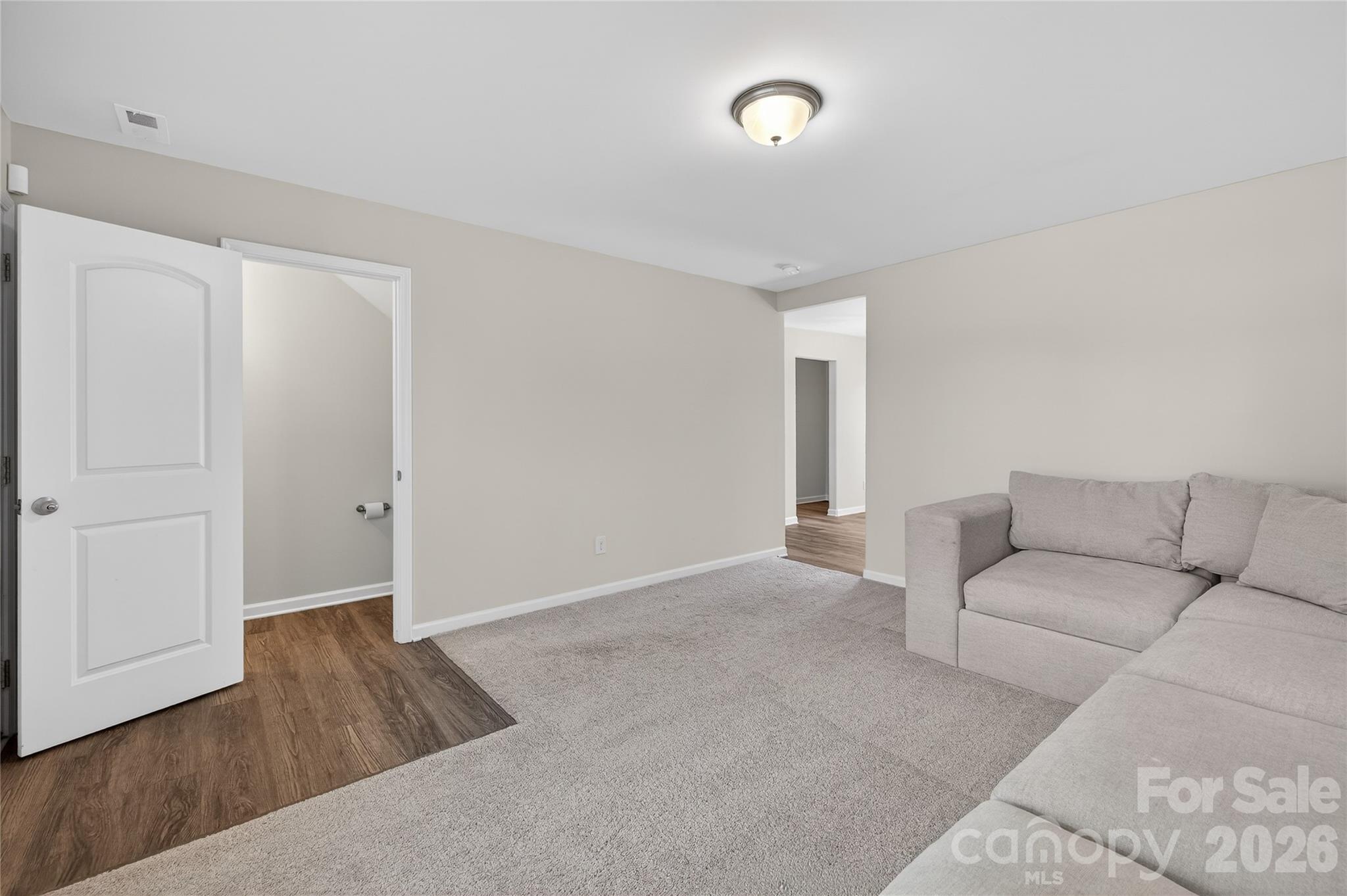 128 Pleasant Hill Street Lancaster, SC 29720 - Photo 12 of 26 a living room with furniture and wooden floor