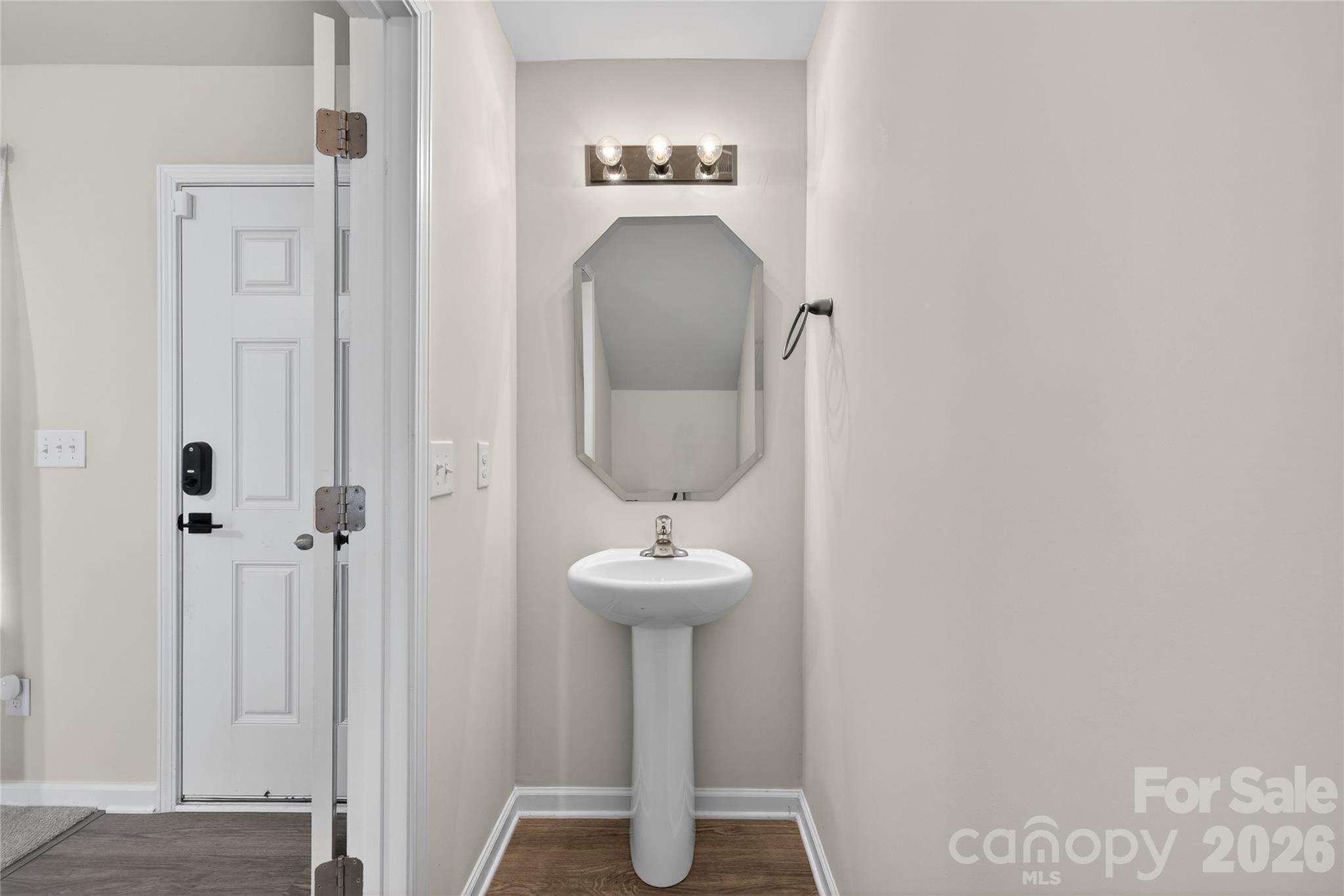 128 Pleasant Hill Street Lancaster, SC 29720 - Photo 13 of 26 a bathroom with a sink and a mirror