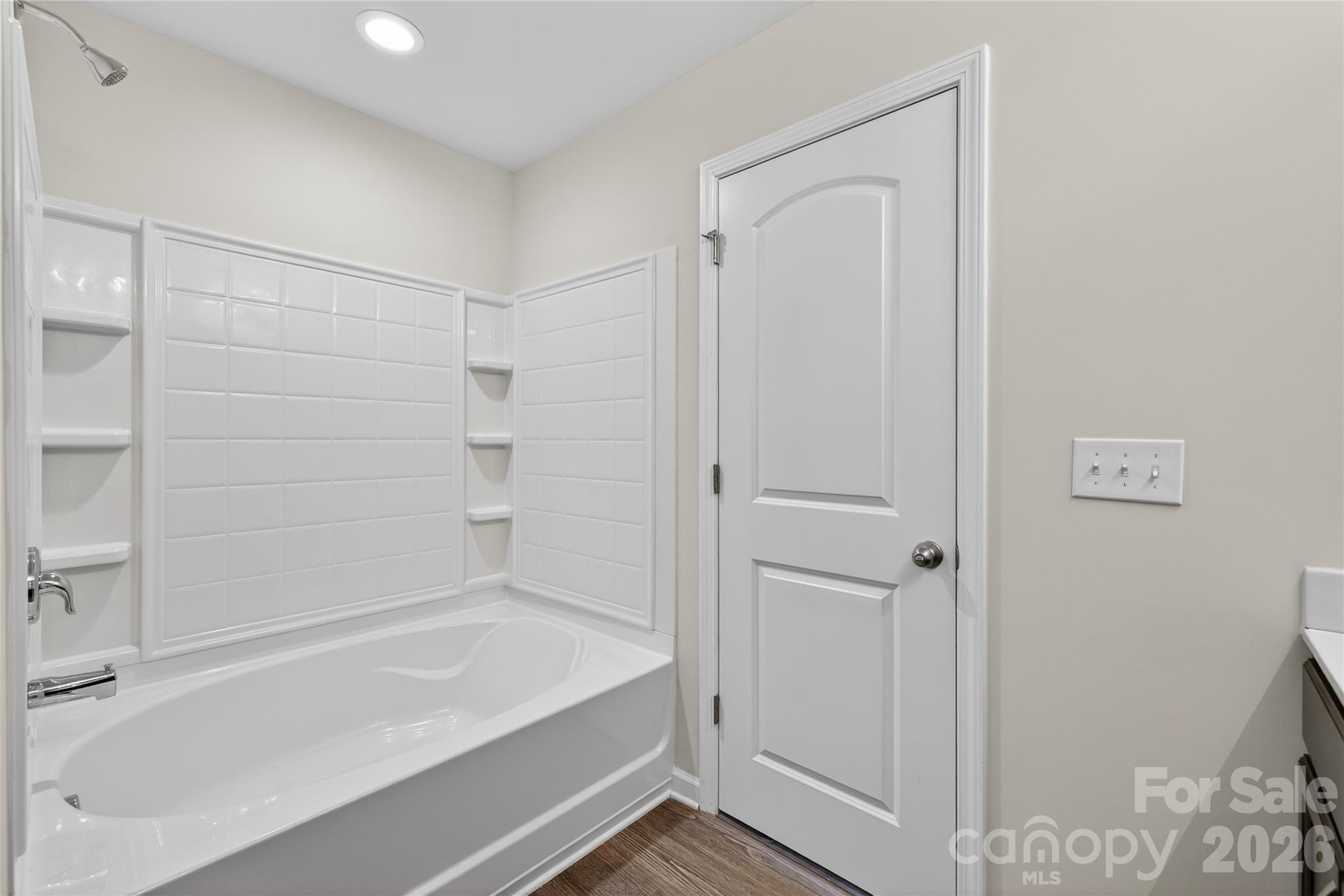 128 Pleasant Hill Street Lancaster, SC 29720 - Photo 19 of 26 a bathroom with a bathtub and shower