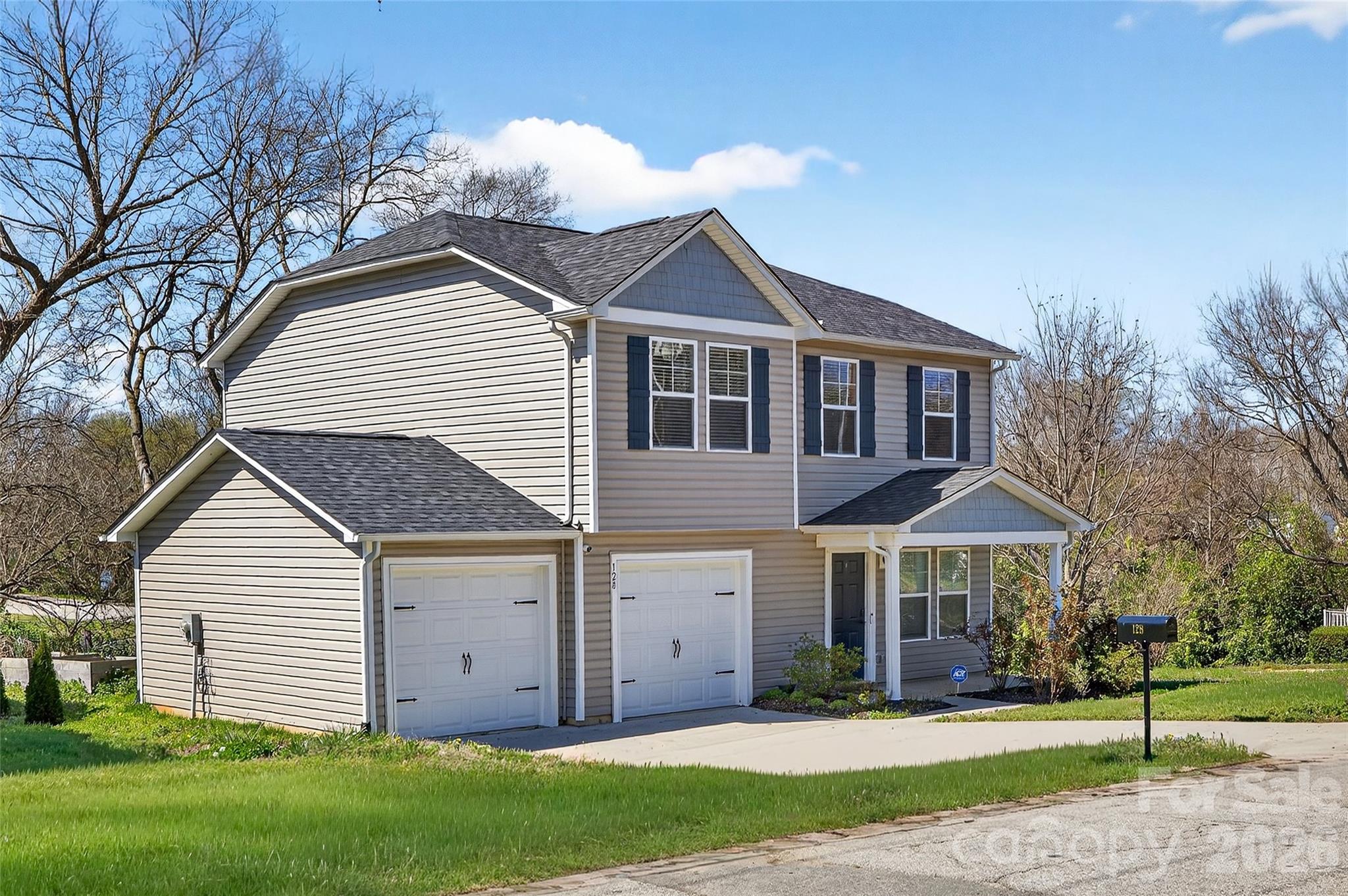 128 Pleasant Hill Street Lancaster, SC 29720 - Photo 2 of 26 a view of a house with a yard