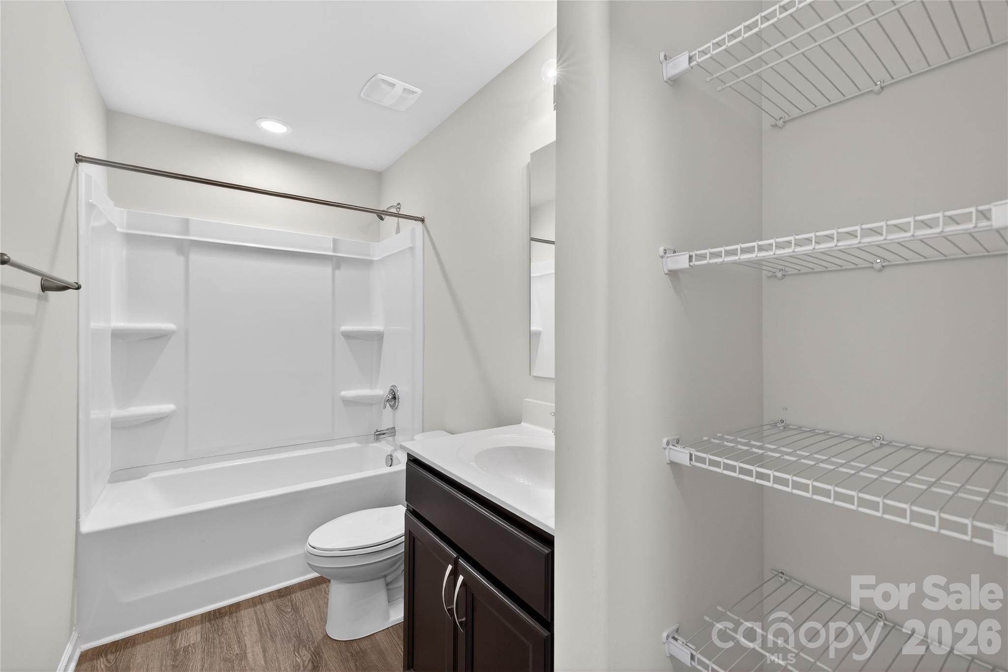 128 Pleasant Hill Street Lancaster, SC 29720 - Photo 22 of 26 a bathroom with a sink a toilet and a bathtub