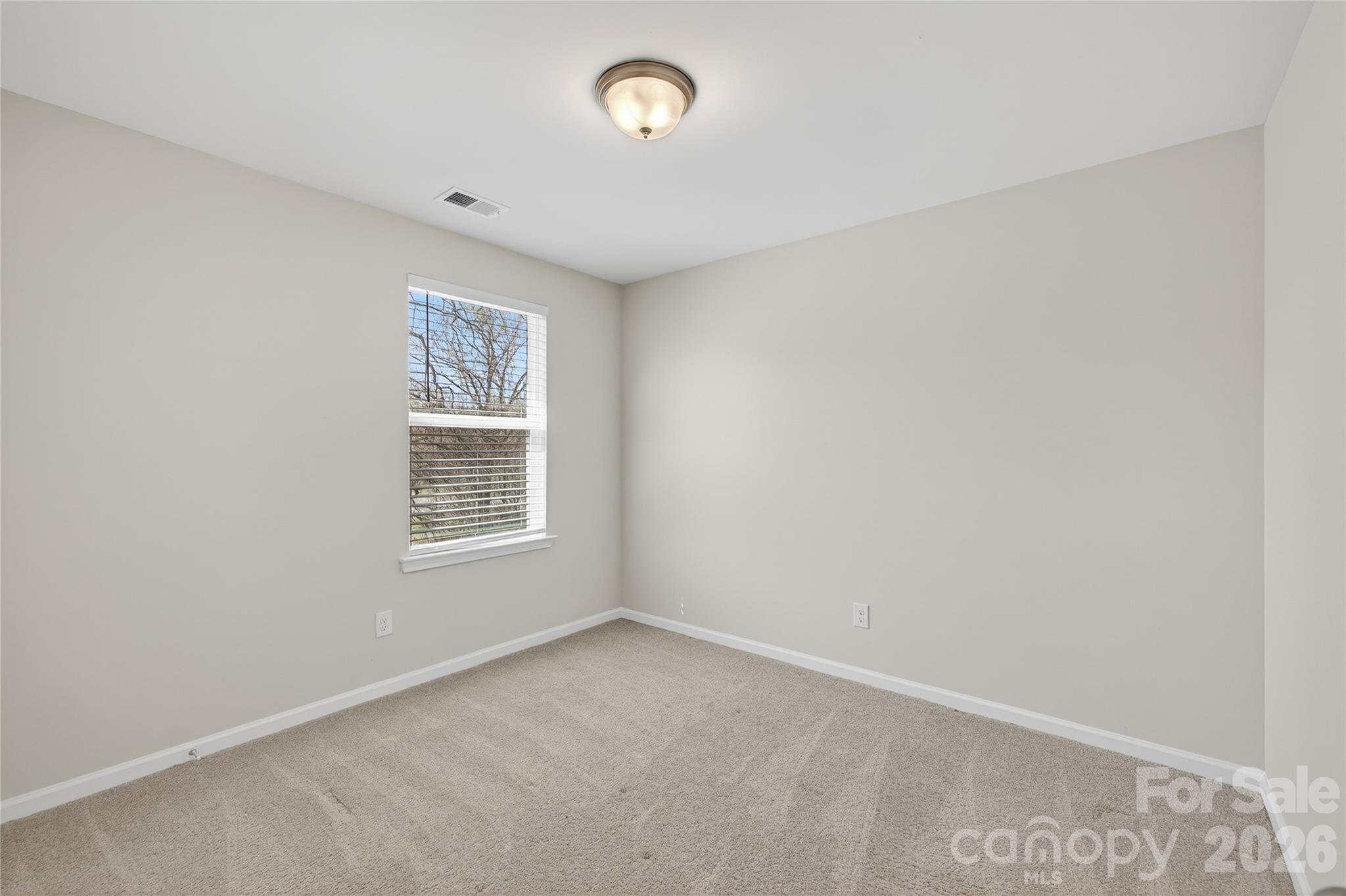 128 Pleasant Hill Street Lancaster, SC 29720 - Photo 23 of 26 an empty room with a window