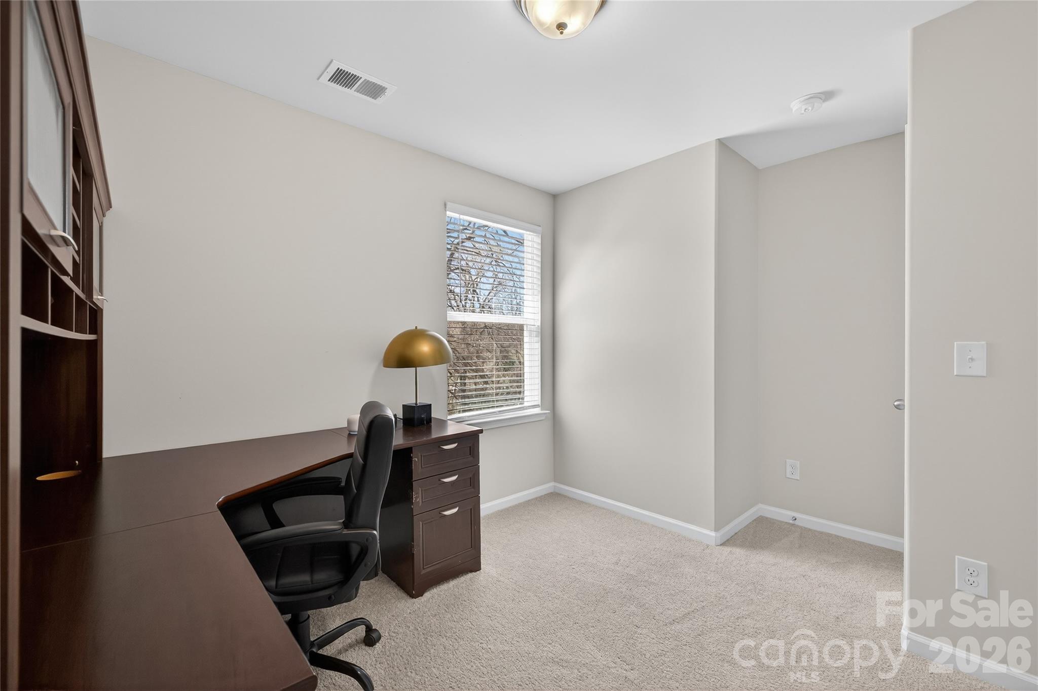 128 Pleasant Hill Street Lancaster, SC 29720 - Photo 25 of 26 a workspace with furniture and window