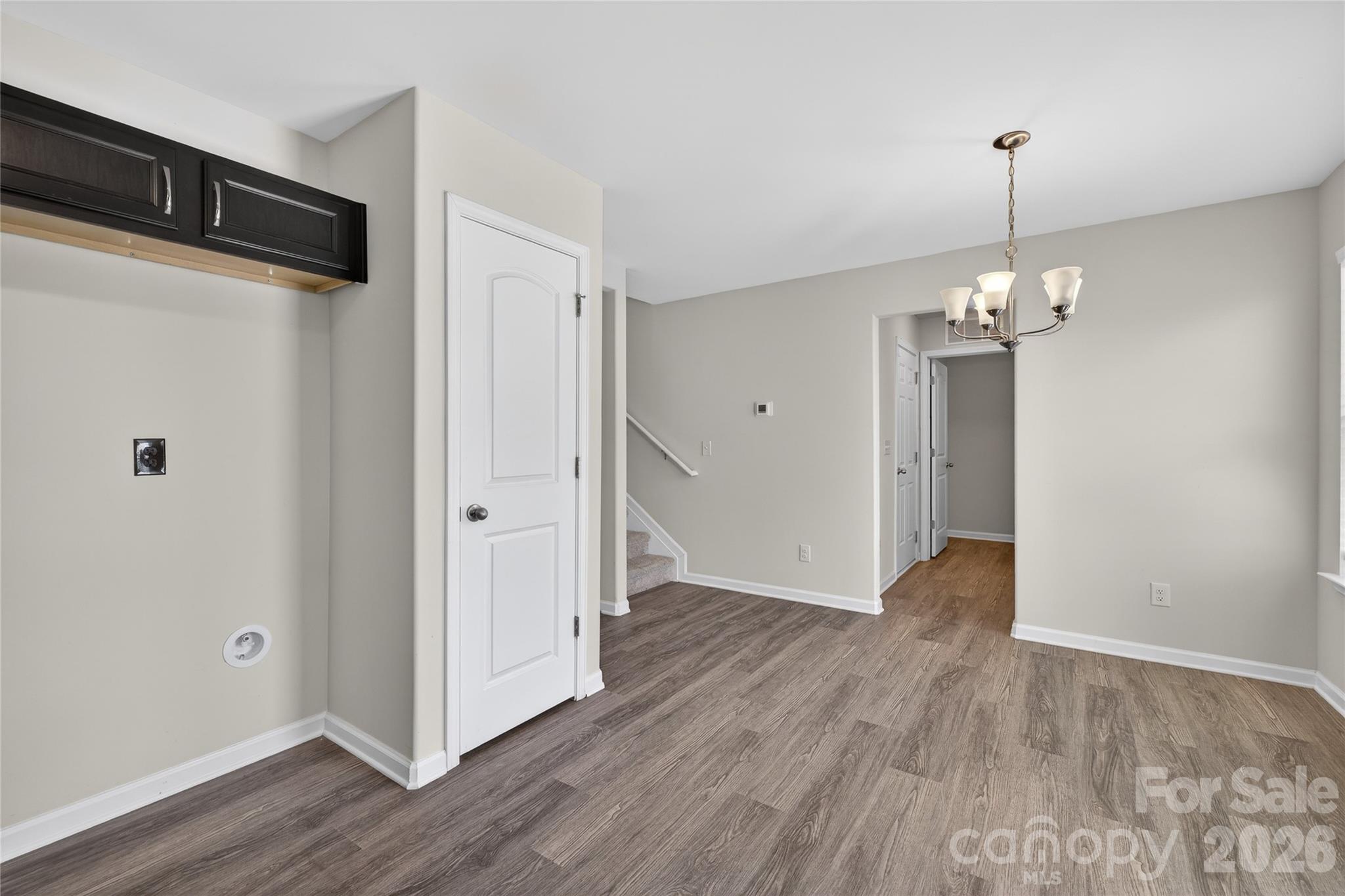 128 Pleasant Hill Street Lancaster, SC 29720 - Photo 9 of 26 a view of a hallway with wooden floor and staircase