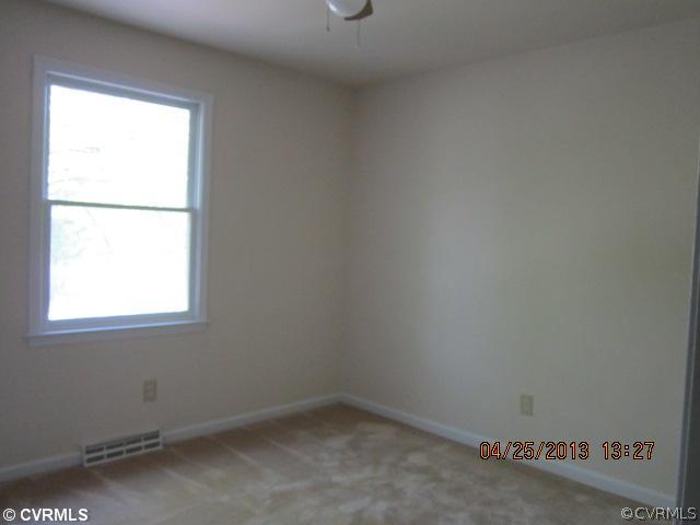 1512 Austin Road Chester, VA 23836 - Photo 12 of 14 an empty room with a window
