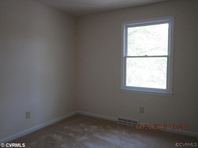1512 Austin Road Chester, VA 23836 - Photo 13 of 14 an empty room with a window
