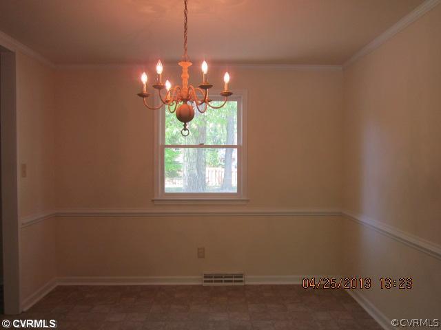 1512 Austin Road Chester, VA 23836 - Photo 4 of 14 a room with window and a chandelier