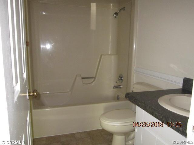 1512 Austin Road Chester, VA 23836 - Photo 7 of 14 a bathroom with a sink toilet and shower