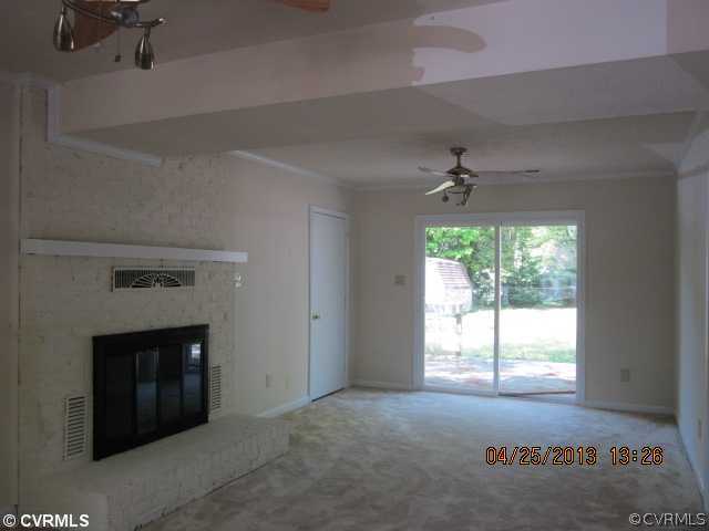 1512 Austin Road Chester, VA 23836 - Photo 8 of 14 a view of an empty room with a fireplace