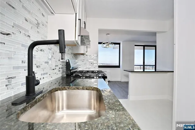 a view of a livingroom with furniture and window