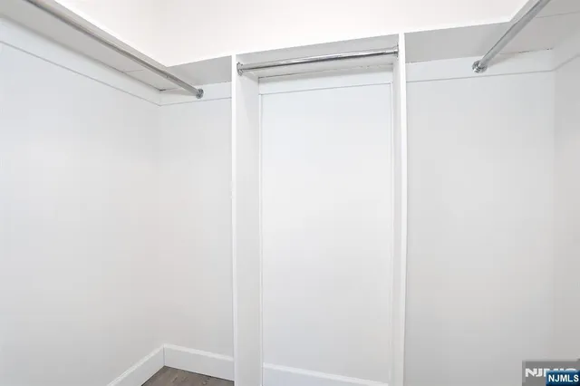 a bathroom with a granite countertop sink a toilet and bathtub