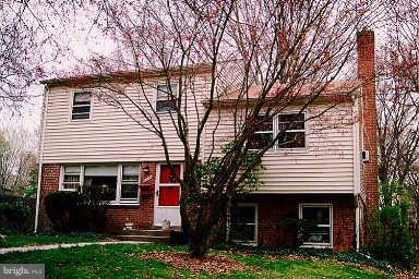 3914 Isbell Street Silver Spring, MD 20906 - Photo 1 of 17 a front view of a house with garden