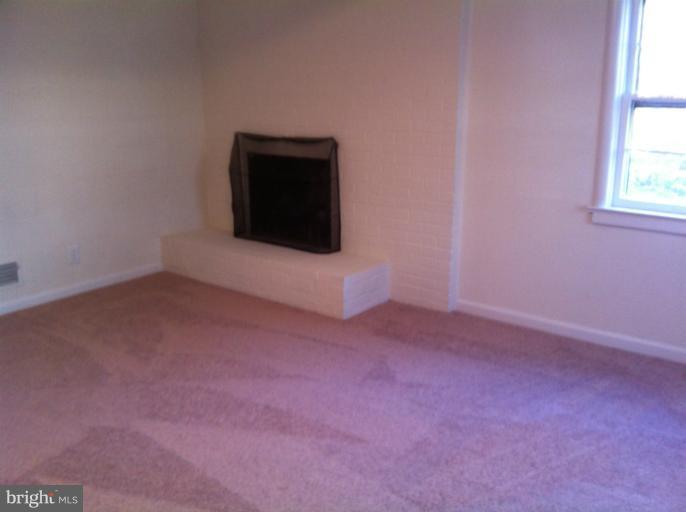 3914 Isbell Street Silver Spring, MD 20906 - Photo 2 of 17 a view of a house with an empty space and a window