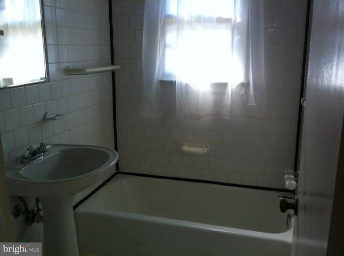 3914 Isbell Street Silver Spring, MD 20906 - Photo 11 of 17 a bathroom with a sink and bathtub