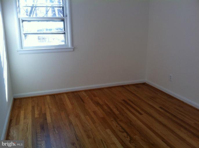 3914 Isbell Street Silver Spring, MD 20906 - Photo 12 of 17 a view of wooden floor in a room