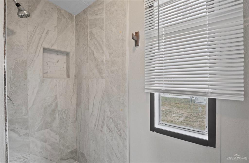 115 East Which Way Pharr, TX 78577 - Photo 14 of 20 Bathroom with a marble finish shower