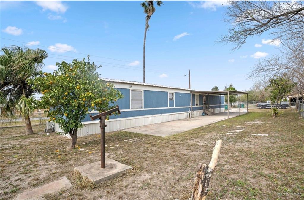 115 East Which Way Pharr, TX 78577 - Photo 2 of 20 Back of property with a patio area