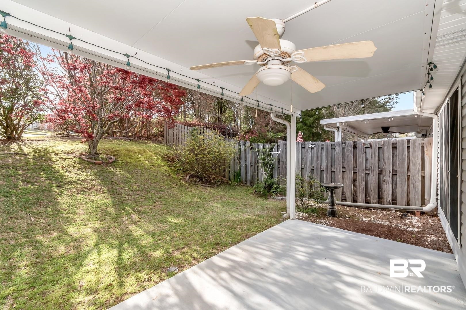 672 Spring Lake Drive East Mobile, AL 36695 - Photo 7 of 26 View of yard featuring a patio, a fenced backyard, and a ceiling fan