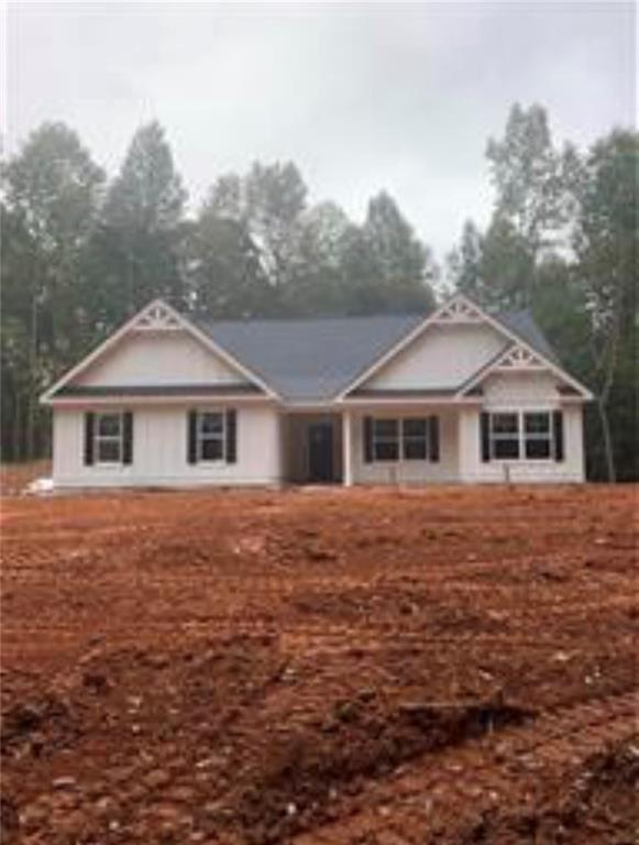 2258 Carlan Road Fairmount, GA 30139 - Photo 1 of 1 a front view of a house with a yard