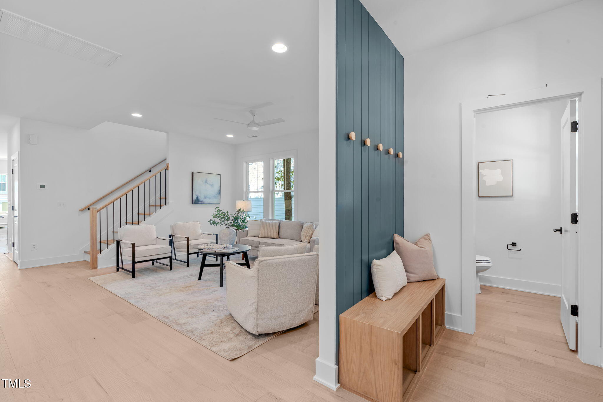5053 Lundy Drive, Unit 102 Raleigh, NC 27606 - Photo 31 of 53 a living room with furniture and a table