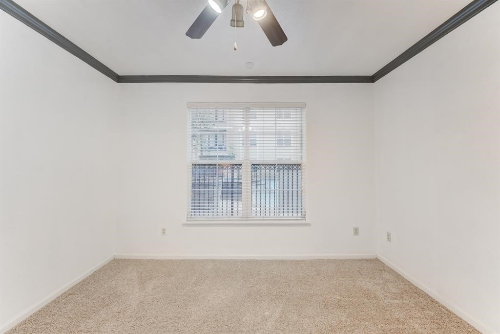 1711 Old Spanish Trail, Unit 110 Houston, TX 77054 - Photo 14 of 31 an empty room with a empty space and windows