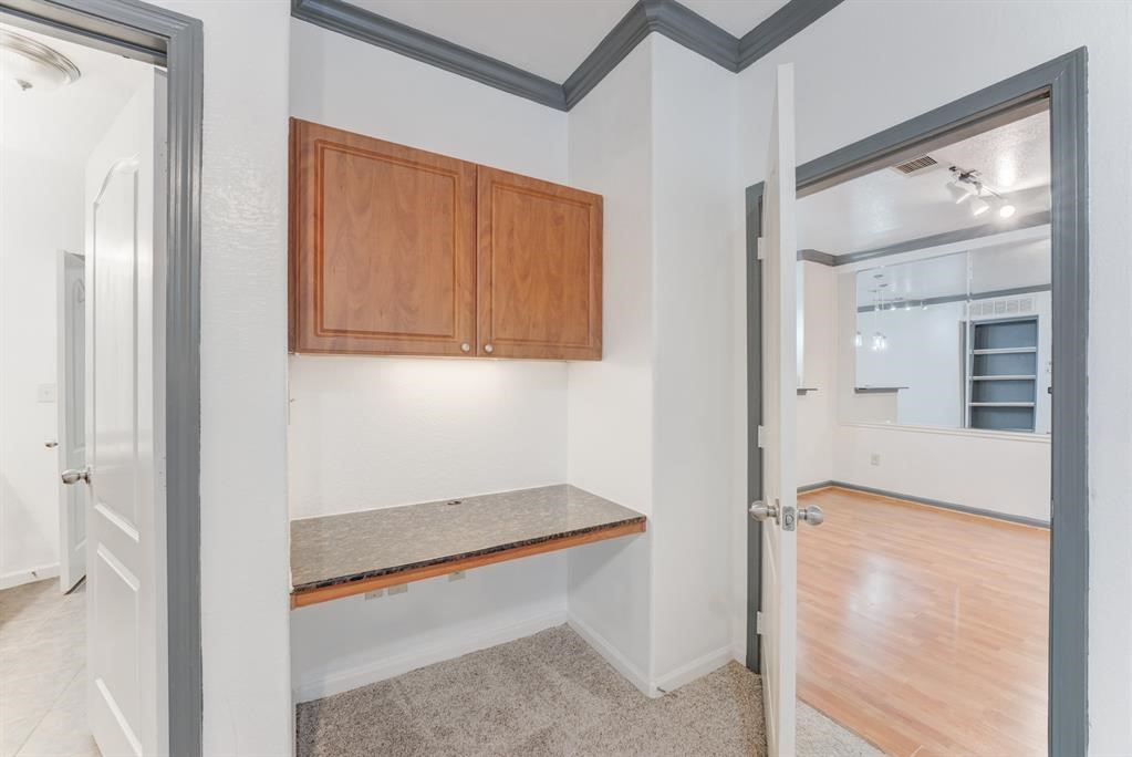 1711 Old Spanish Trail, Unit 110 Houston, TX 77054 - Photo 20 of 31 a hallway with sliding door and yard
