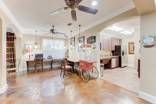 a view of a livingroom with furniture and a flat screen tv