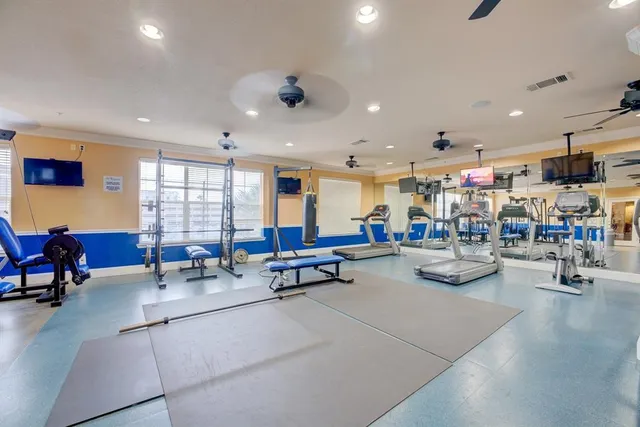 a living room with lots of furniture and white walls