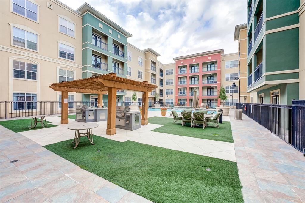 1711 Old Spanish Trail, Unit 110 Houston, TX 77054 - Photo 28 of 31 a view of a building with a yard